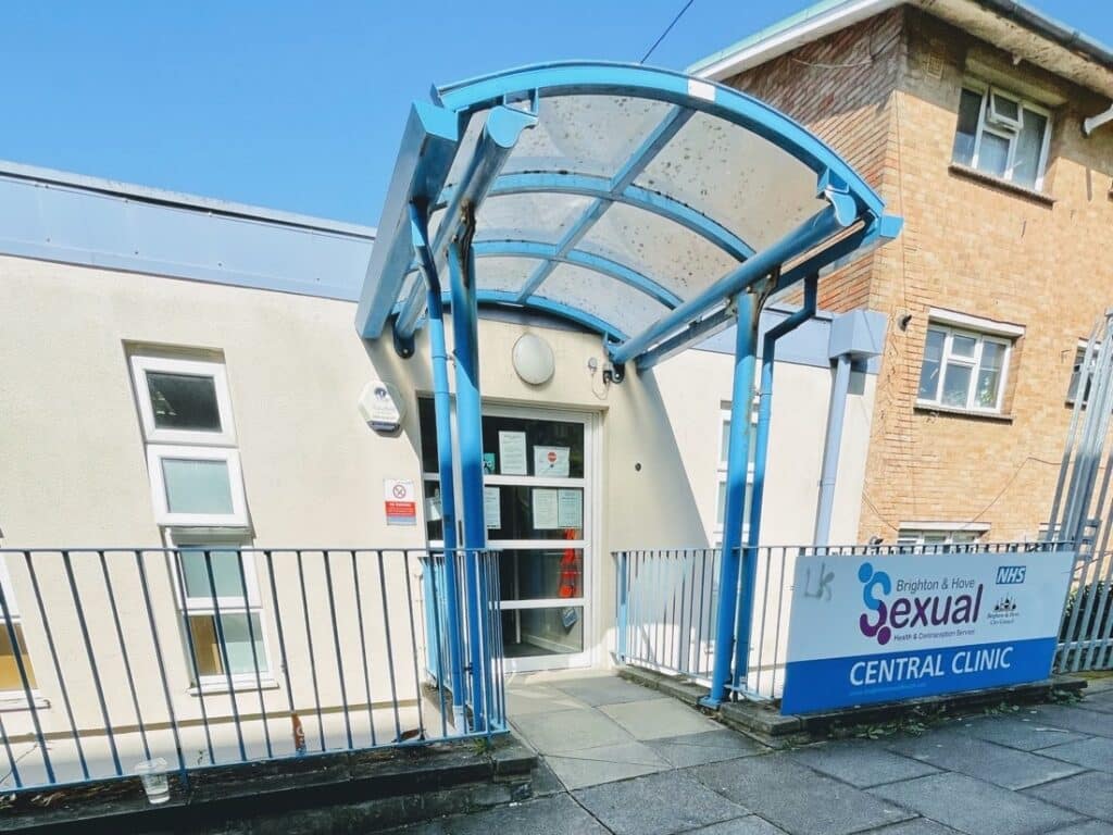 If you want to describe to someone what the outside of SHAC Central looks like, viewed from the path that leads from Morley Street, it's a white building, the front door is under a covered blue archway and there's a sign to the right of the entrance saying Central clinic.