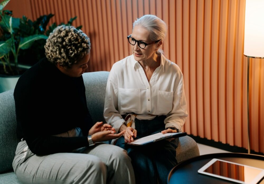 Two people talking with clip chart