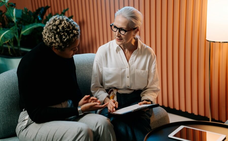 Two people talking with clip chart