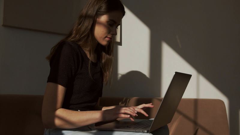 Person typing on laptop