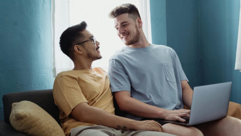 two men smiling laptop