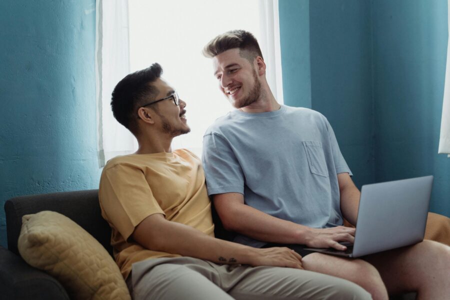 two men smiling laptop