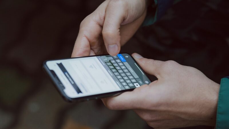 person receiving text message on phone