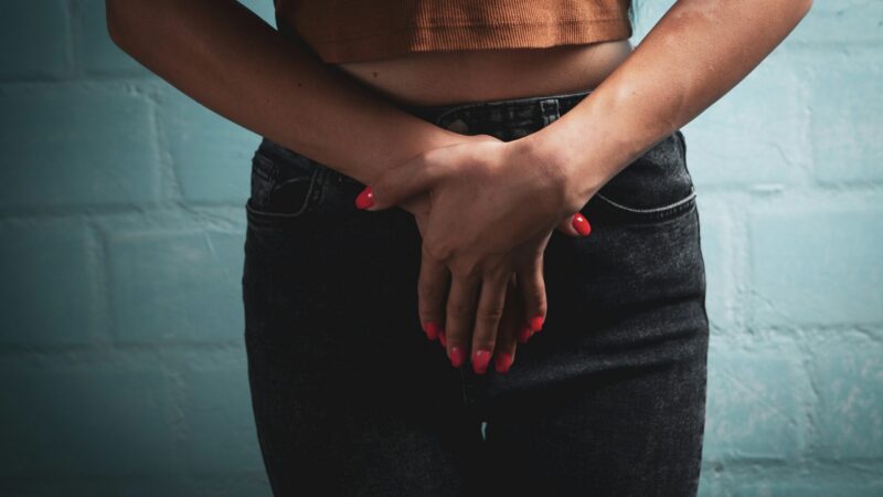 woman hands covering vagina