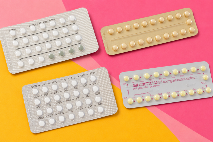 Four different contraceptive pill blister packs on a pink and yellow background