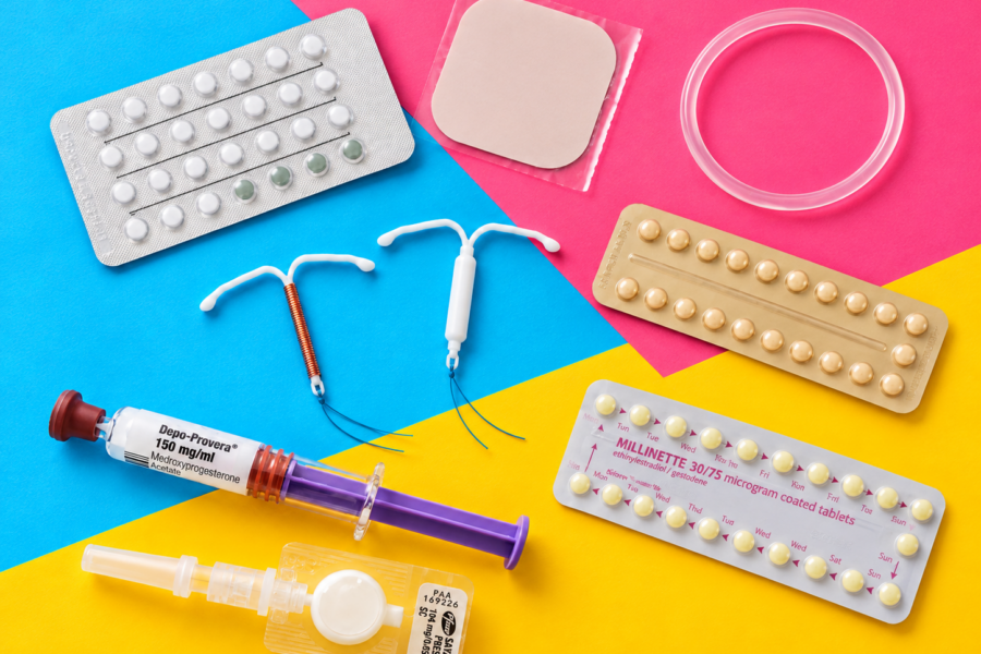 A selection of contraceptive methods, including pills, a patch, vaginal ring, contraceptive injection and two types of IUD.